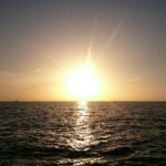 sunrise with body of water